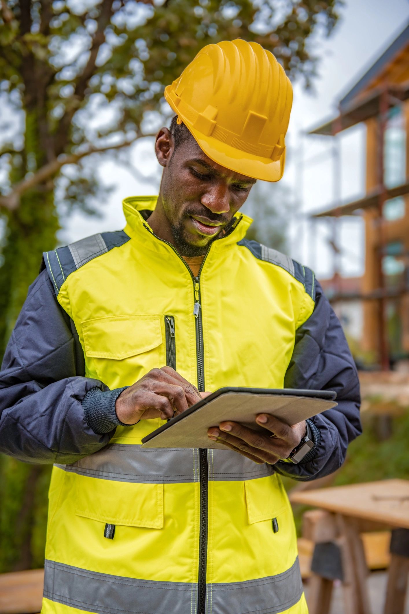 Project manager using a tablet on site
