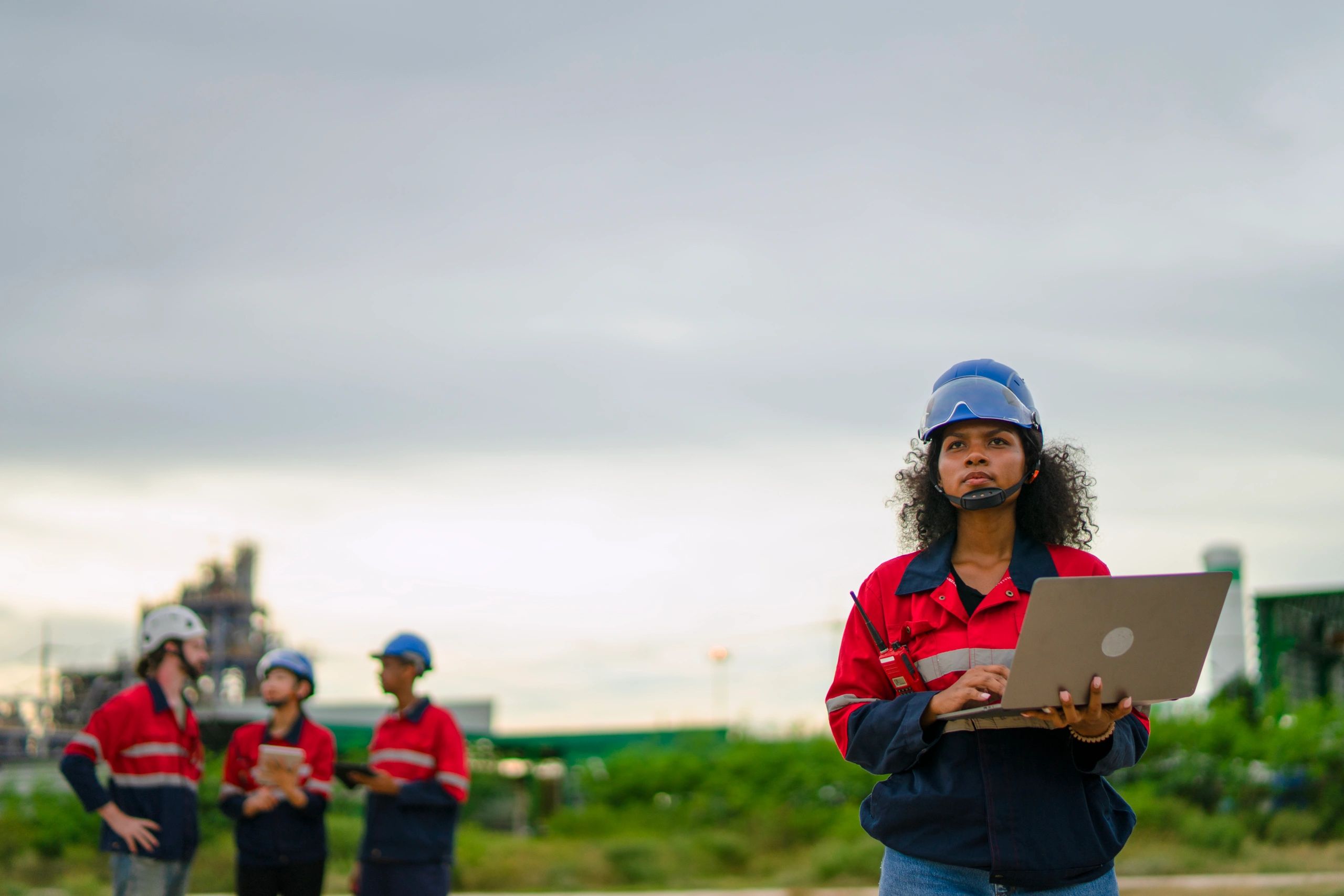 Construction professionals working at an industrial site