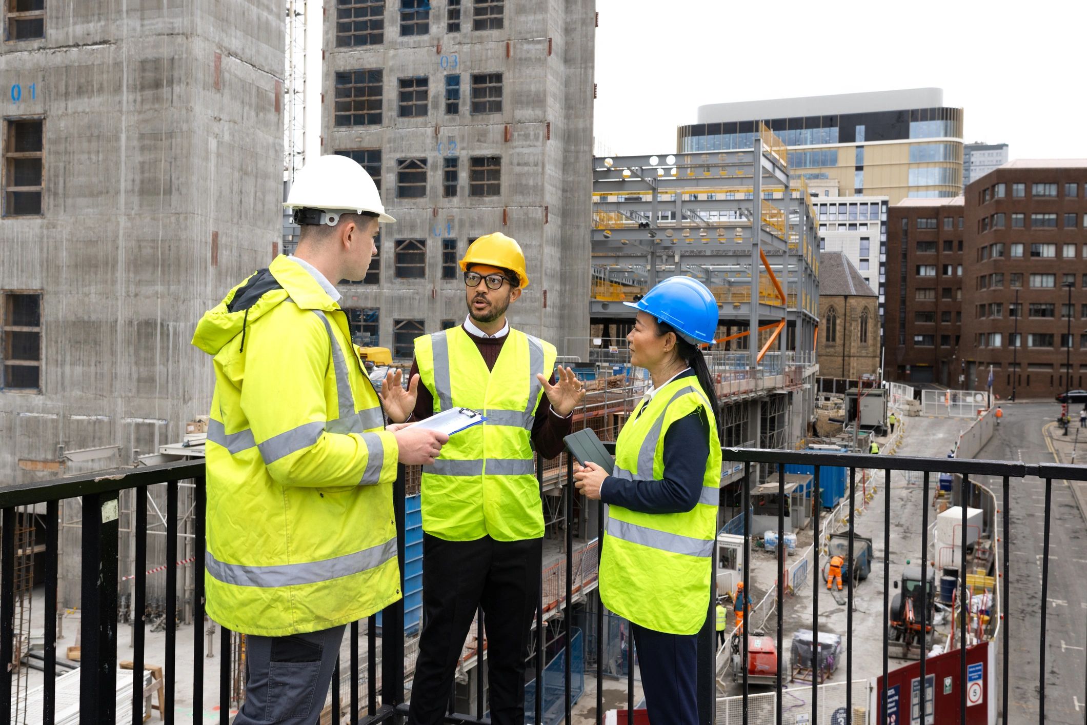 Construction project team reviewing plans on site